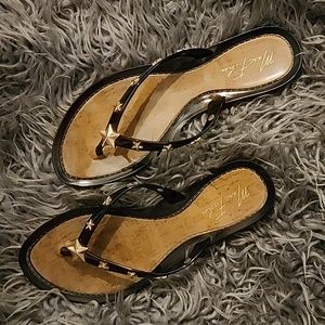 Marc Fisher black and gold star studden flip flops